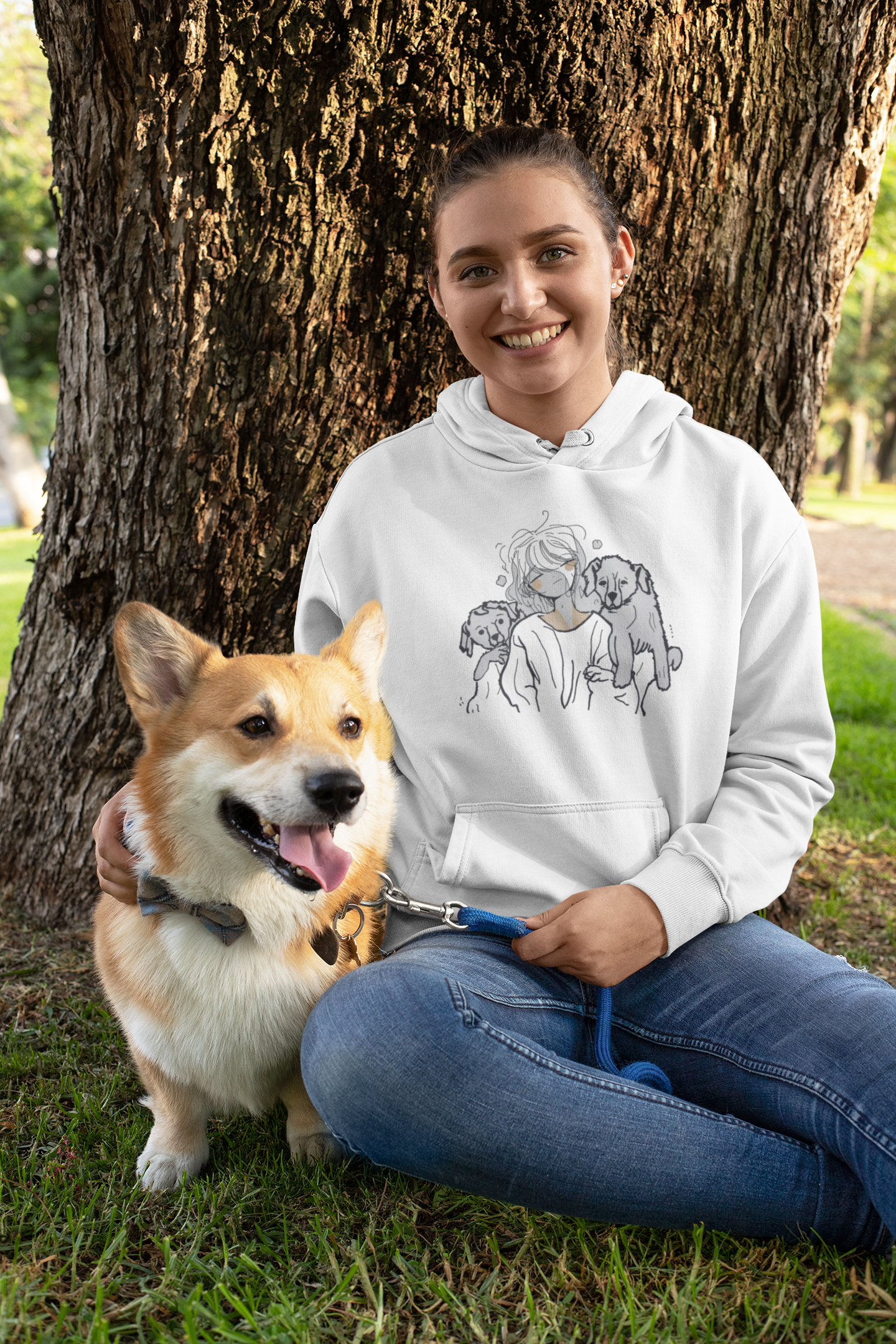 Woman with corgi wearing white hoodie with dog lover print
